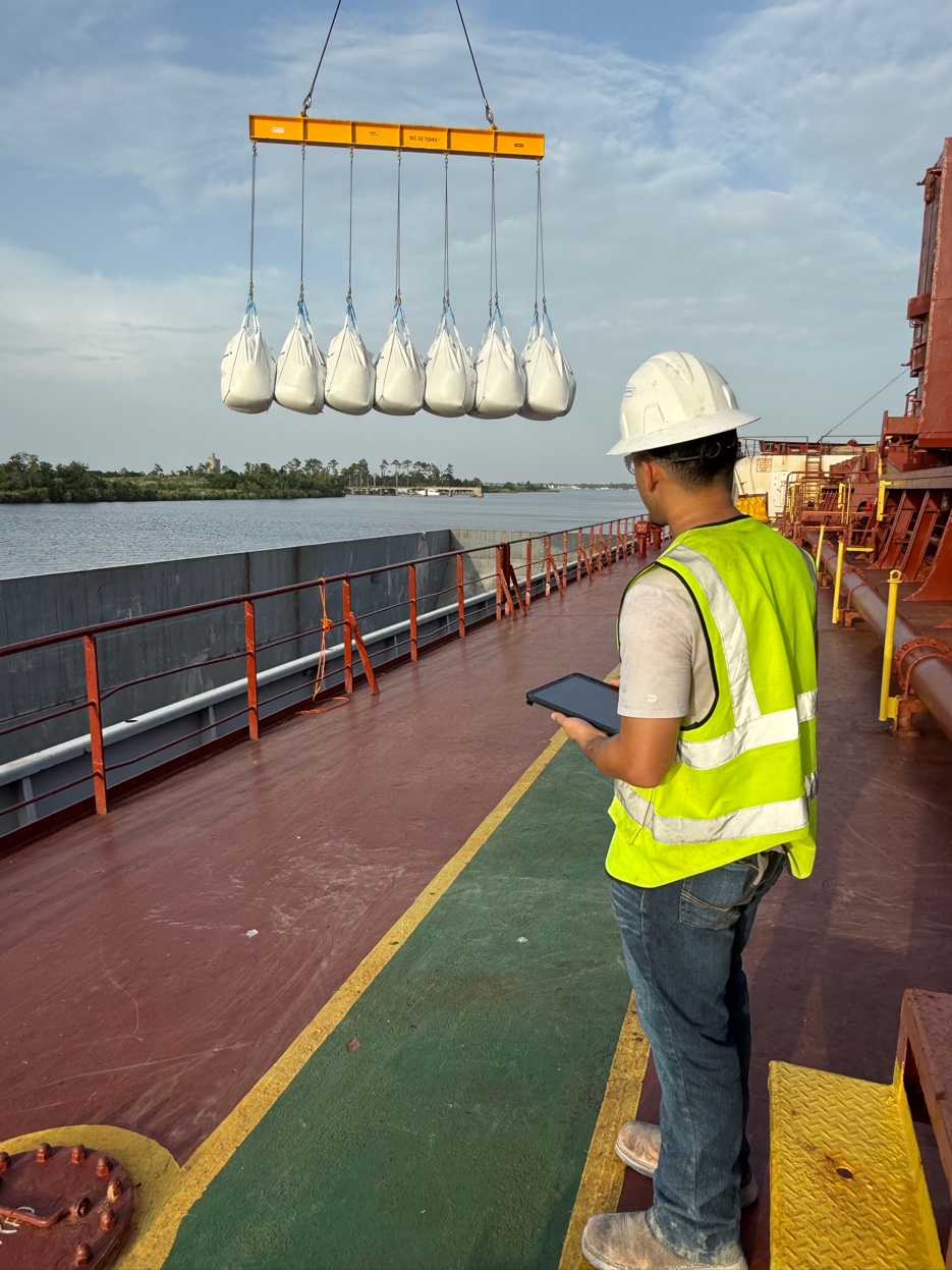 GCS crew supervisor on deck with tablet — live Knomatic platform access tracking compliance and operational reporting during active discharge